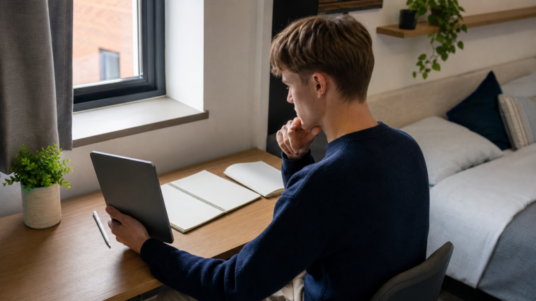 Best tablets for university notes UK student comparing a tablet with paper notebooks